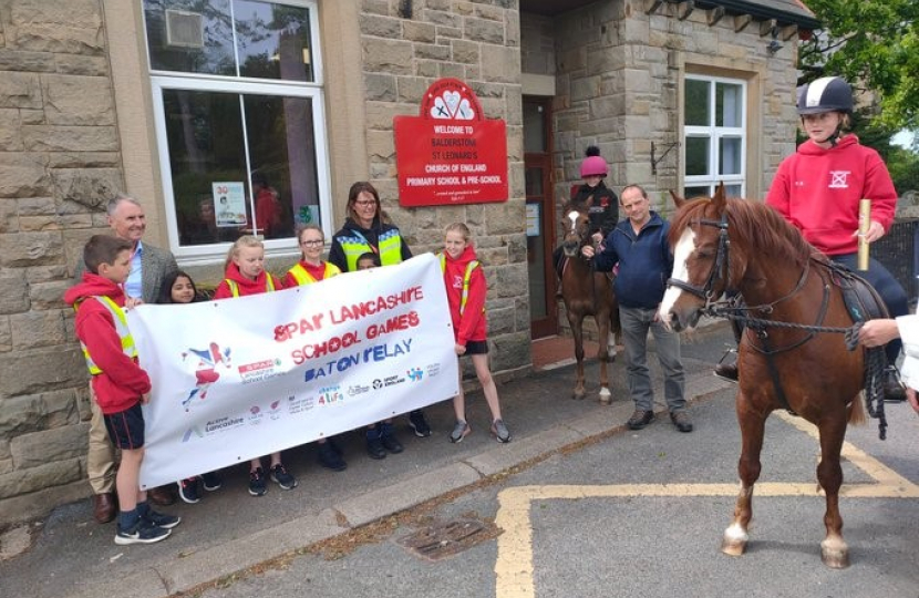 Pictured - Nigel Evans outside Balderstone Primary School ahead of the transporting the Baton to Salesbury