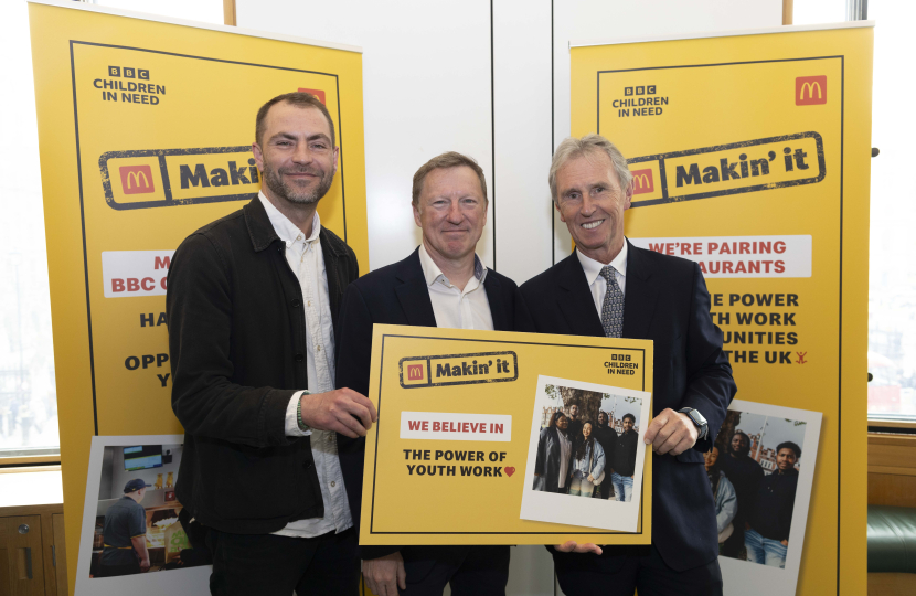 Nigel photographed with representatives from McDonalds and Children in Need